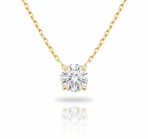 Gold necklace with a round diamond pendant on a white background