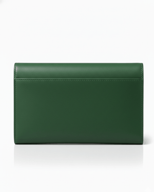 Green leather clutch bag on a white background