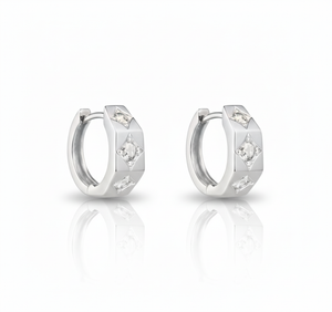 Pair of silver hoop earrings with small diamonds on a white background