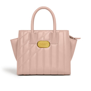 Pink quilted handbag with a gold tag on a white background