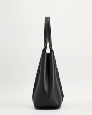 Black handbag on a light gray background