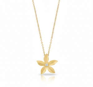 Gold flower-shaped necklace with a diamond on a white background