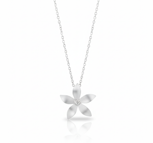 Silver flower-shaped pendant necklace on a white background
