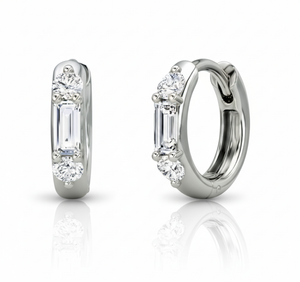 Pair of diamond hoop earrings on a white background