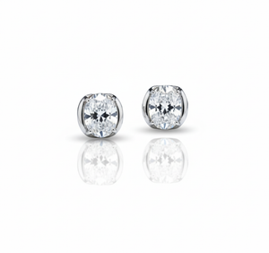 Pair of diamond stud earrings on a white background
