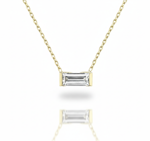 Gold necklace with a rectangular diamond pendant on a white background