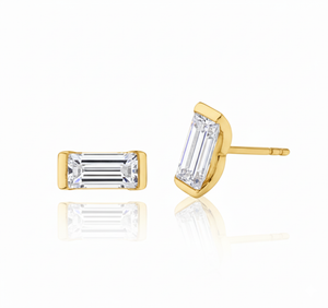 Gold stud earrings with baguette-cut gemstones on a white background