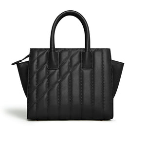 Black quilted handbag on a white background