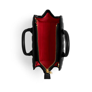 Black handbag with red interior on a white background