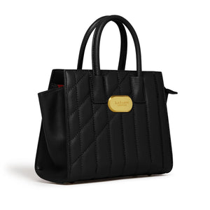 Black quilted handbag with a gold clasp on a white background