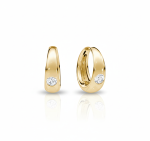 Gold hoop earrings with embedded diamonds on a white background