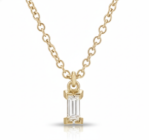 Gold necklace with a diamond pendant on a white background
