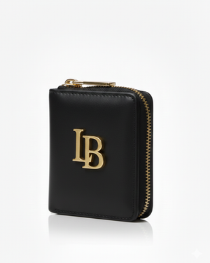 Black wallet with gold zipper and initials on a white background