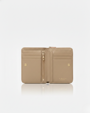 Beige wallet with gold zipper on a white background