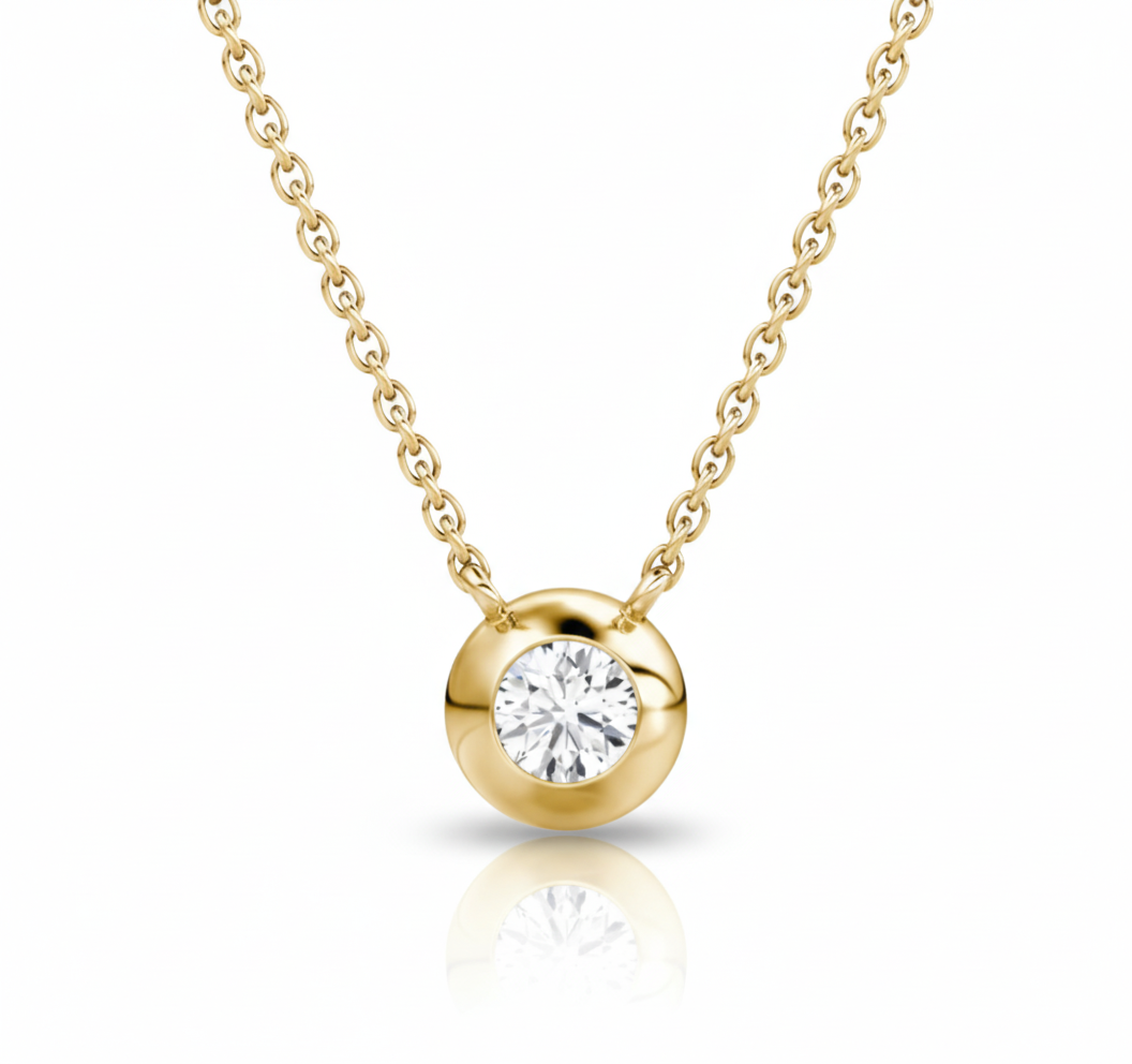 Gold necklace with a diamond pendant on a white background