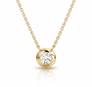 Gold necklace with a diamond pendant on a white background