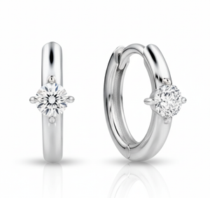 Pair of silver hoop earrings with clear gemstones on a white background
