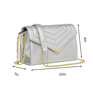 Silver handbag with gold chain and measurements on a white background